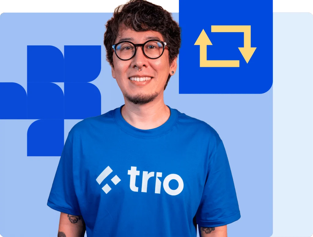 Smiling software engineer wearing a Trio t-shirt, symbolizing expert fintech engineering rescue and recovery support