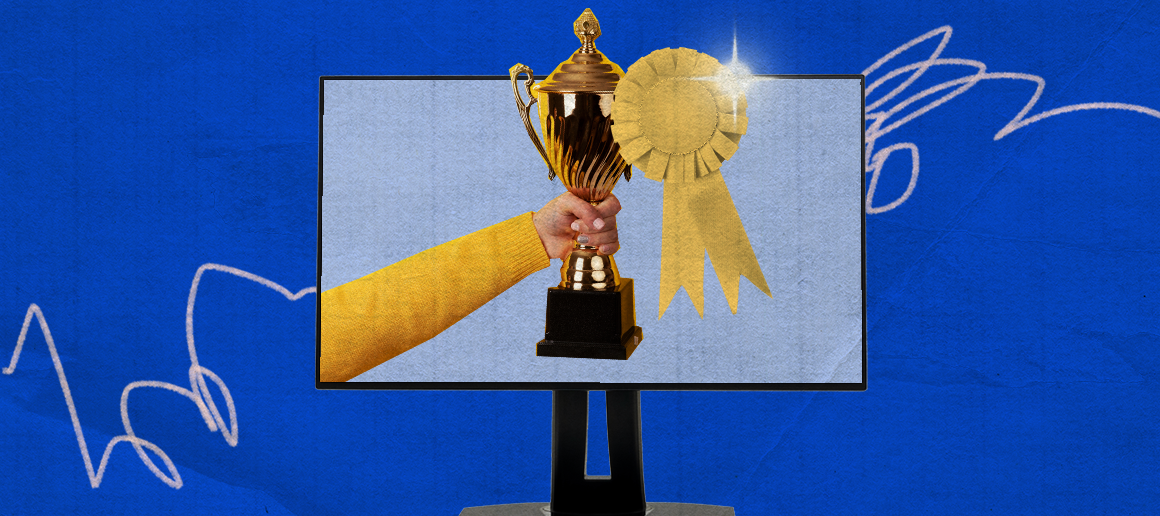 Hand holding a trophy on a digital display, conceptually indicating a victory or achievement in a competition, with artistic wings and sparkles in the background.