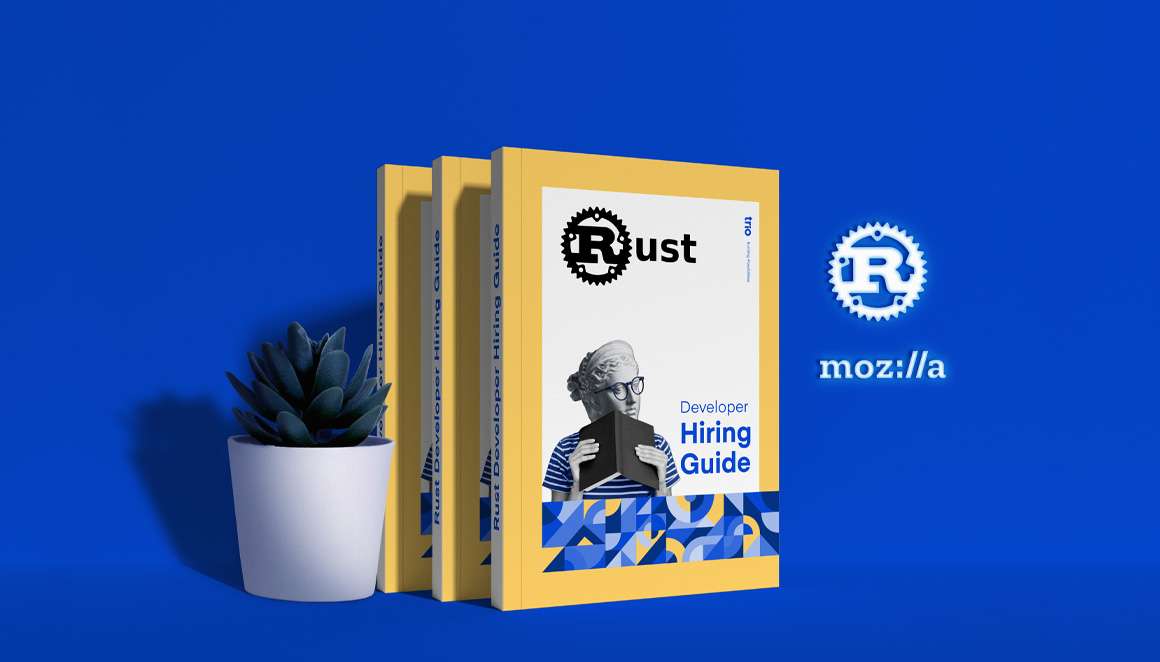 Promotional display featuring a stack of books titled 'Rust Developer Hiring Guide' with a cover image of a person reading, a small succulent plant, and neon logos of Rust and Mozilla against a blue background.