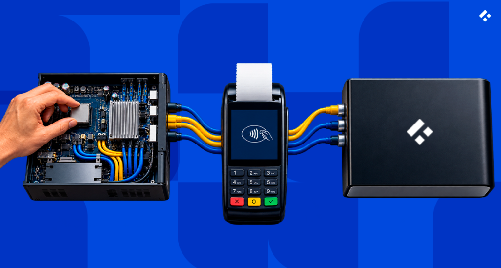 Hand wiring a motherboard to a payment terminal and branded hardware box, representing the build vs. buy decision for a payment orchestration platform